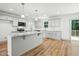 Bright kitchen with granite countertops, stainless appliances and island at 5500 Lake Wendell Rd, Zebulon, NC 27597