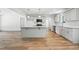 Modern kitchen featuring an island with granite countertops and stainless steel appliances at 5500 Lake Wendell Rd, Zebulon, NC 27597