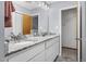 Bathroom includes tile floors, marble countertops, double sinks, and a view of additional rooms at 5593 Leon Rd, Nashville, NC 27856