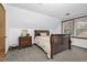 Bedroom includes carpet, natural light, and a wood dresser for storage and style at 5593 Leon Rd, Nashville, NC 27856