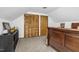Bedroom with carpet features a closet and wood accents, perfect for relaxation and organization at 5593 Leon Rd, Nashville, NC 27856