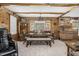 Charming dining room with a large table, benches, and natural light from bay windows at 5593 Leon Rd, Nashville, NC 27856