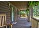 Inviting front porch with rocking chairs, a swing, and a welcoming atmosphere at 5593 Leon Rd, Nashville, NC 27856