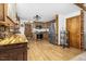 Charming kitchen features wood cabinetry, stainless steel appliances, and wood-look tile flooring at 5593 Leon Rd, Nashville, NC 27856
