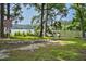 Scenic lake view with dock access and resident signage at 5593 Leon Rd, Nashville, NC 27856