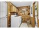 Functional laundry room with wooden wall accents and a standard washer and dryer at 5593 Leon Rd, Nashville, NC 27856