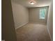 Cozy carpeted bedroom with natural light from a single window at 57 Blanton Ct, Lillington, NC 27546