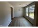 Dining room with wood floors and large windows at 57 Blanton Ct, Lillington, NC 27546