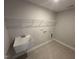 This functional laundry room is equipped with a utility sink and ample shelving for storage and convenience at 57 Blanton Ct, Lillington, NC 27546