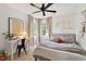 Bedroom filled with natural light with decorative name art on the wall, and a cozy sleeping area at 5833 Dahlberg Dr, Raleigh, NC 27603