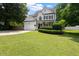 Charming two-story home features a manicured lawn, attached garage, and welcoming front porch at 5833 Dahlberg Dr, Raleigh, NC 27603