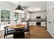 Bright eat-in kitchen featuring granite counters, stainless appliances, and natural light at 5833 Dahlberg Dr, Raleigh, NC 27603
