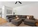 Comfortable living room with a large sectional sofa, decorative pillows and wall decor at 5833 Dahlberg Dr, Raleigh, NC 27603
