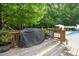 Inviting pool area features an outside grill, and a tranquil space for enjoying the outdoors at 5833 Dahlberg Dr, Raleigh, NC 27603