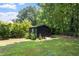Storage shed or workshop located in a private, grassy area at 5833 Dahlberg Dr, Raleigh, NC 27603