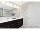 Bright bathroom features a double sink vanity, large mirror, and modern fixtures at 59 Curling Creek Dr # I285, Clayton, NC 27527