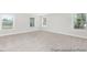 Spacious bedroom with neutral carpet and abundant natural light from three windows at 59 Curling Creek Dr # I285, Clayton, NC 27527