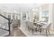 Elegant dining area with a glass table, stylish chairs, and abundant natural light at 59 Curling Creek Dr # I285, Clayton, NC 27527