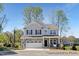 Charming two-story home featuring a stone facade, two-car garage, and a well-maintained front yard at 59 Curling Creek Dr # I285, Clayton, NC 27527