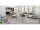 Open living space with hardwood floors, large windows, and stylish furnishings and decor at 59 Curling Creek Dr # I285, Clayton, NC 27527