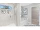 Luxurious main bathroom with a glass-enclosed shower, soaking tub, and modern fixtures at 59 Curling Creek Dr # I285, Clayton, NC 27527