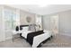 Serene main bedroom with natural light, neutral tones, and stylish decor at 59 Curling Creek Dr # I285, Clayton, NC 27527