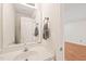 Bright bathroom featuring a sleek white vanity, modern faucet, and well-lit mirror at 6051 Epping Forest Dr, Raleigh, NC 27613