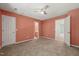 Spacious bedroom with multiple doorways and neutral carpet at 6051 Epping Forest Dr, Raleigh, NC 27613