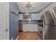 Updated kitchen with stainless steel appliances, white cabinets, and granite countertops at 6051 Epping Forest Dr, Raleigh, NC 27613