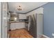 Updated kitchen with stainless steel appliances, white cabinets, and granite countertops at 6051 Epping Forest Dr, Raleigh, NC 27613