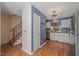 Updated kitchen with stainless steel appliances, white cabinets, and granite countertops at 6051 Epping Forest Dr, Raleigh, NC 27613