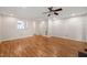 Spacious living room with wood floors, a view of the kitchen and access to another room at 6051 Epping Forest Dr, Raleigh, NC 27613