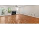 Bright living room featuring wood floors, a fireplace, and views to the outdoor area at 6051 Epping Forest Dr, Raleigh, NC 27613