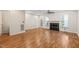 Inviting living room with a fireplace, wood floors, ceiling fan, and access to a patio at 6051 Epping Forest Dr, Raleigh, NC 27613