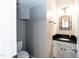 Half bath with vanity featuring granite counter tops and great mirror at 6205 Remington Lake Dr, Raleigh, NC 27616