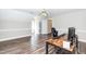 Spacious bonus room with hardwood floors, neutral paint, and modern ceiling fan at 6205 Remington Lake Dr, Raleigh, NC 27616