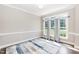 Dining room with a large windows and gray curtains at 6205 Remington Lake Dr, Raleigh, NC 27616