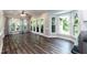 Bright dining room with hardwood floors and large windows overlooking the backyard at 6205 Remington Lake Dr, Raleigh, NC 27616