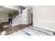Entryway featuring a carpeted staircase, a hardwood floor and gray colored walls at 6205 Remington Lake Dr, Raleigh, NC 27616