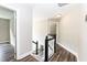 Bright hallway features wood floors, white trim, and stairway to the main floor at 6205 Remington Lake Dr, Raleigh, NC 27616