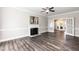 Spacious living room with a fireplace, ceiling fan and french doors at 6205 Remington Lake Dr, Raleigh, NC 27616