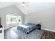 Bright main bedroom with vaulted ceiling and large windows for natural light at 6205 Remington Lake Dr, Raleigh, NC 27616