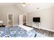 Spacious main bedroom with vaulted ceiling, ceiling fan, and access to the bathroom at 6205 Remington Lake Dr, Raleigh, NC 27616