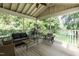Relaxing screened porch with comfortable seating and views of the lake at 6205 Remington Lake Dr, Raleigh, NC 27616