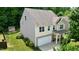 Aerial view of a two-story house with a well-manicured lawn and a shed at 642 Collington Dr, Mebane, NC 27302