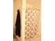 Bathroom features a floral patterned shower curtain and a dark-colored robe hanging on the wall at 642 Collington Dr, Mebane, NC 27302