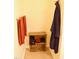 Storage area in bathroom with brown towels and a dark purple bathrobe at 642 Collington Dr, Mebane, NC 27302