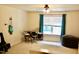 Bedroom with a window letting in natural light, drum set, guitar, and beanbag chair at 642 Collington Dr, Mebane, NC 27302