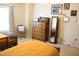 Bedroom with two twin beds, a dresser, a full-length mirror, neutral walls, and natural lighting at 642 Collington Dr, Mebane, NC 27302