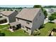 Two-story home with a covered patio, well-manicured lawn, and mature trees in a lovely neighborhood at 642 Collington Dr, Mebane, NC 27302